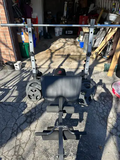 For sale marcy Olympic workout bench with preacher curl and leg extension. Includes everything in th...