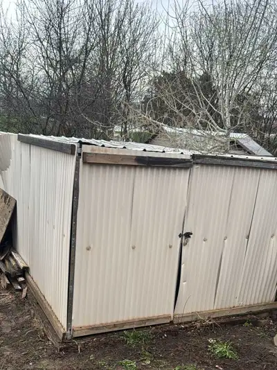 This is a metal shed that has seen better days. As you can see from the photos, it is in fair condit...