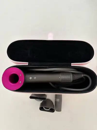 Super sonic Dyson hair dryer. Includes all the accessories and the pink leather case. Excellent cond...