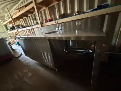Large commercial refrigerated prep station. Features: Stainless work surface Built-in sink Refrigera...