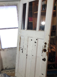 Wooden door with antique hinges and lock since 1947