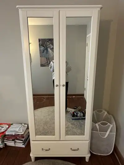White IKEA wardrobe with full length mirror, space for hanging, shelves, and a drawer. Used but in g...
