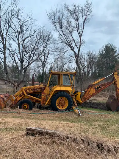 1973 Massey Ferguson 70 industrial backhoe, starts and runs. Has a transmission issue, it has no rev...