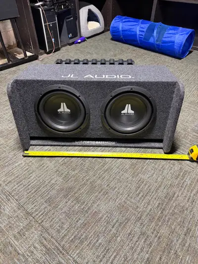 I'm selling a JL Audio BassWedge enclosed car subwoofer with dual 10" W0v3 subwoofers, paired with a...