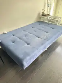 Blue sofa bed with 2 pillows 