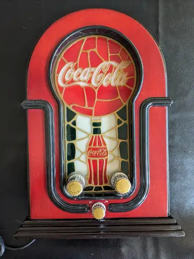 This Coca-Cola Radio AM FM is a must-have for any collector or fan of the iconic brand. With its vin...