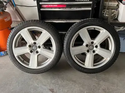 Selling a set of Audi wheels with Michelin X-Ice winter tires, sized at 245/40R18, perfect for provi...