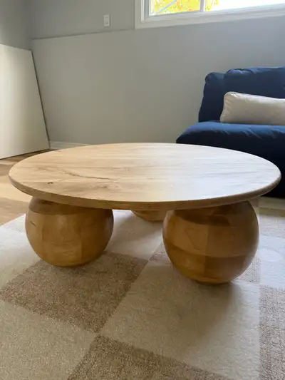 Modern round coffee table with ball legs, View more