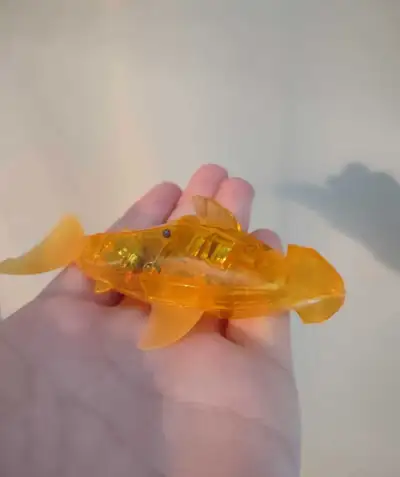 fill bowl of water and press grey button for it to swim. great condition, super entertaining. needs...