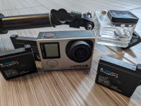 GoPro Hero 4 Silver with waterproof case, stick, and 3 batteries