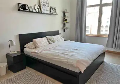 This is a used IKEA Malm bed frame with the headboard and storage drawers, providing both style and...