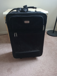 Black soft-sided carry-on suitcase