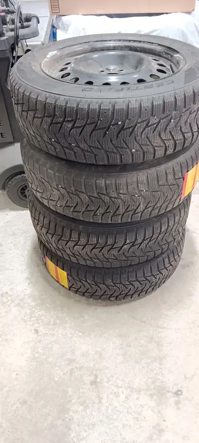 4 Winter Trek winter tires on steel rims - 215/60R17 - sold by Canadian Tire and made by Hankook - c...