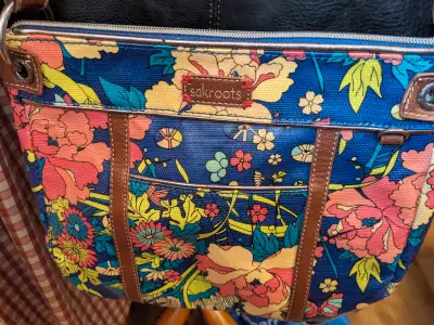 Check out this The Sak crossbody bag, featuring a vibrant floral design. This used bag has some wear...