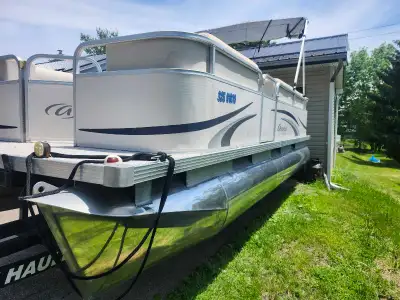 Selling a 2010 aurora pontoon boat with 25 hp johnson 4 stroke .with easyload trailer .boat overall...