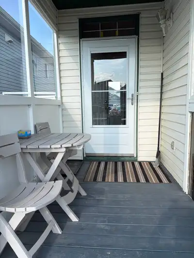 Furnished 1 bedroom suite, smart tv in bedroom and living room, computer, couch & chair, bar height...