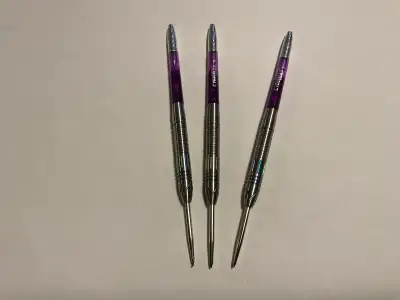 Selling a set of new in sealed box CyeeLife darts with a sleek purple design, ideal for both casual...