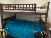 Full over full bunk bed. Mattresses and sheets included.