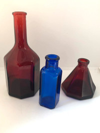 Three vintage red and cobalt blue mini bottles
