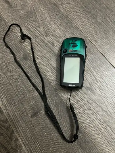 I'm selling a used Garmin eTrex Venture personal navigator in good condition, perfect for hiking, ge...