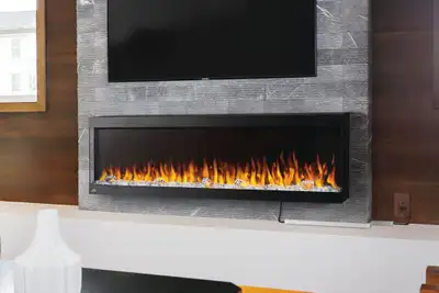 Stay cozy and stylish with this Napoleon 36-inch electric fireplace! Perfect for adding warmth and a...