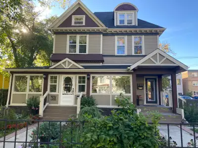 Large loft bedroom has private ensuite bathroom with custom shower. The room has a queen bed, desk,...