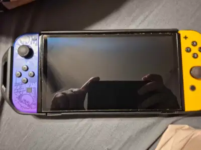Selling my Nintendo Switch OLED model. As you can see in the photos, it has a screen protector on it...