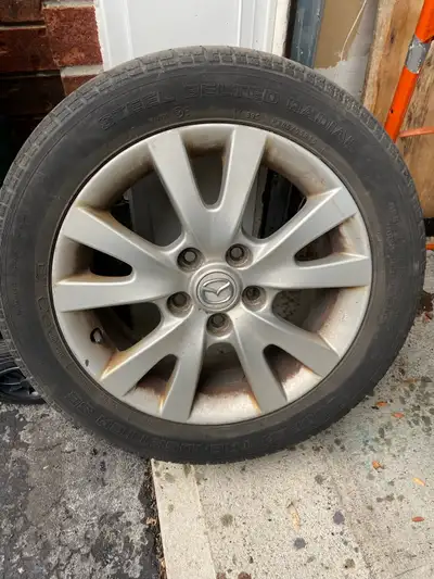 16 inch alloy rim, Mazda stock alloy rims (x4), 5 bolt pattern. Free all season tires (205/55/16). O...