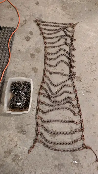 Rear tire chains for 23x10.50-12, oiled and in great shape. Fit on John Deere-210, 285, 320, 345, Ku...