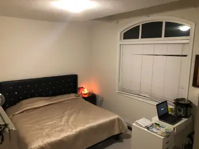 Bedroom in upper floor with washroom (cheater suite) bright and clean furnished room in a newer cust...