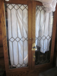 Custom made oak cabinet with leaded glass doors