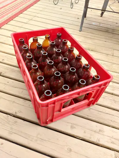 Stubby, vintage beer bottles with case. 13 cases available., View more