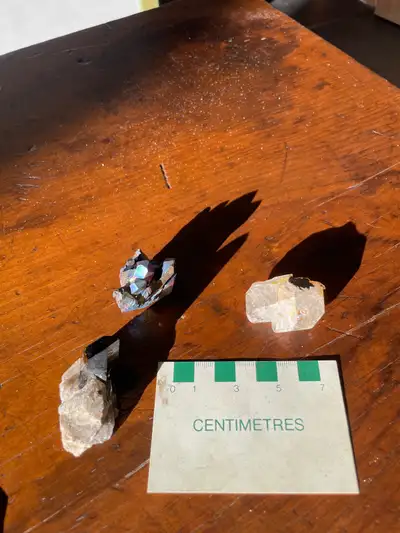 three quartz crystal specimens , View more