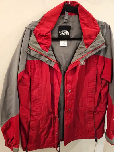 New condition, womans north face shell . hyvent jacket with hood that tucks in. size medium. fleece...