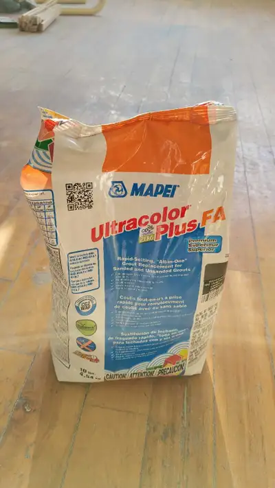 Opened bag of Mapei charcoal grout ultracoulour plus, View more