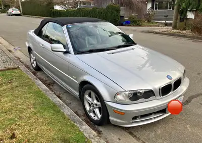 Selling my stylish silver BMW 325i convertible, featuring a smooth automatic transmission and rear-w...