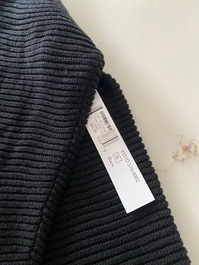 Black ribbed mock neck pullover sweater, View more