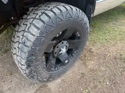 KMC XD Rockstar wheels, 8x6.5 bolt pattern, next to new Haida HD878 R/T tires, 35x12.5R20. Nice setu...