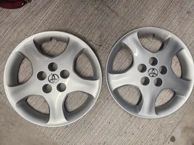 2 x Original 15" Wheel Covers for various models of Toyota Matrix and Corolla between 2005 and 2008...