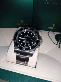 Men's rolex watch submariner box and papers included ()