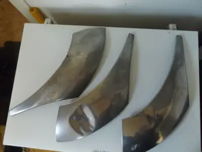 This is an original lot of 3 chrome trim panels for a 1951 Pontiac Chieftain. The panels attach to t...