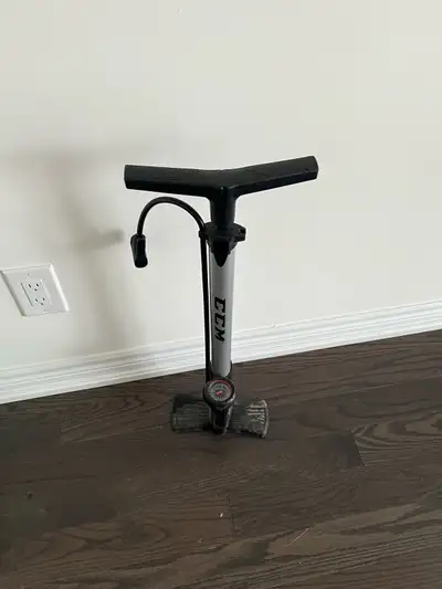 This is a CCM bike pump, perfect for keeping your tires inflated and ready to roll! It's in good wor...