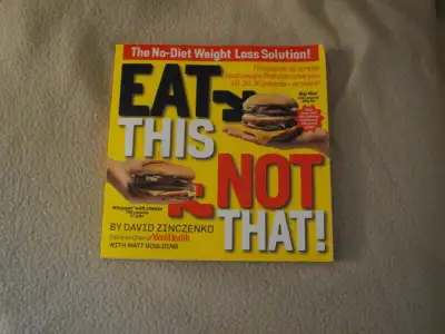 EAT THIS - NOT THAT! softcover book -all colour pictures -excellent condition, no writing in it -$6....