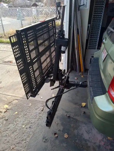 Bruno, model no. ASL-250, electric carrier for wheelchair or scooter hitch mounted,used in new condi...