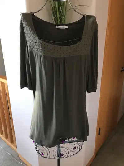 This is a Revolution by Ricki's women's top, size large. It's a stylish and comfortable piece that w...
