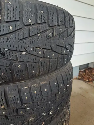 235 65R18 Barely used with lots of tread and stud left on them.