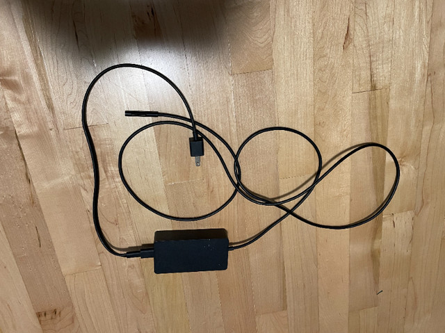 ALMOST BRAND NEW MICROSOFT SURFACE PRO/BOOK CHARGER in Laptop Accessories in Edmonton