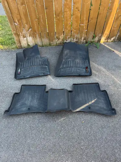 These are used WeatherTech floor mats custom fit for a Kia Sportage, offering superior protection ag...