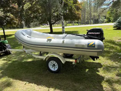 Lightly used stored in heated shop, cover included. Ownership for boat and trailer also. 4000$ OBO.