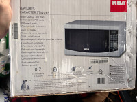 RCA like New 0.7 Cu. ft. Countertop Microwave - White